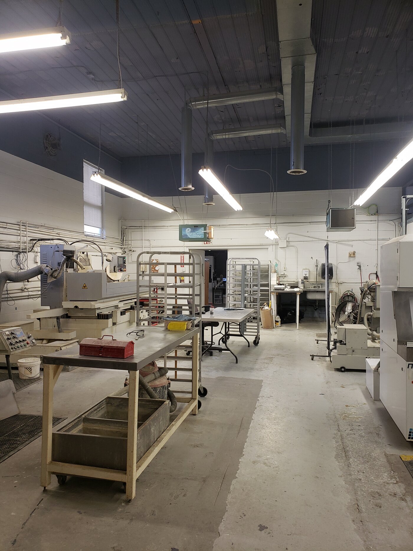 An industrial machining workshop floor maintained by Control Janitorial Barrie